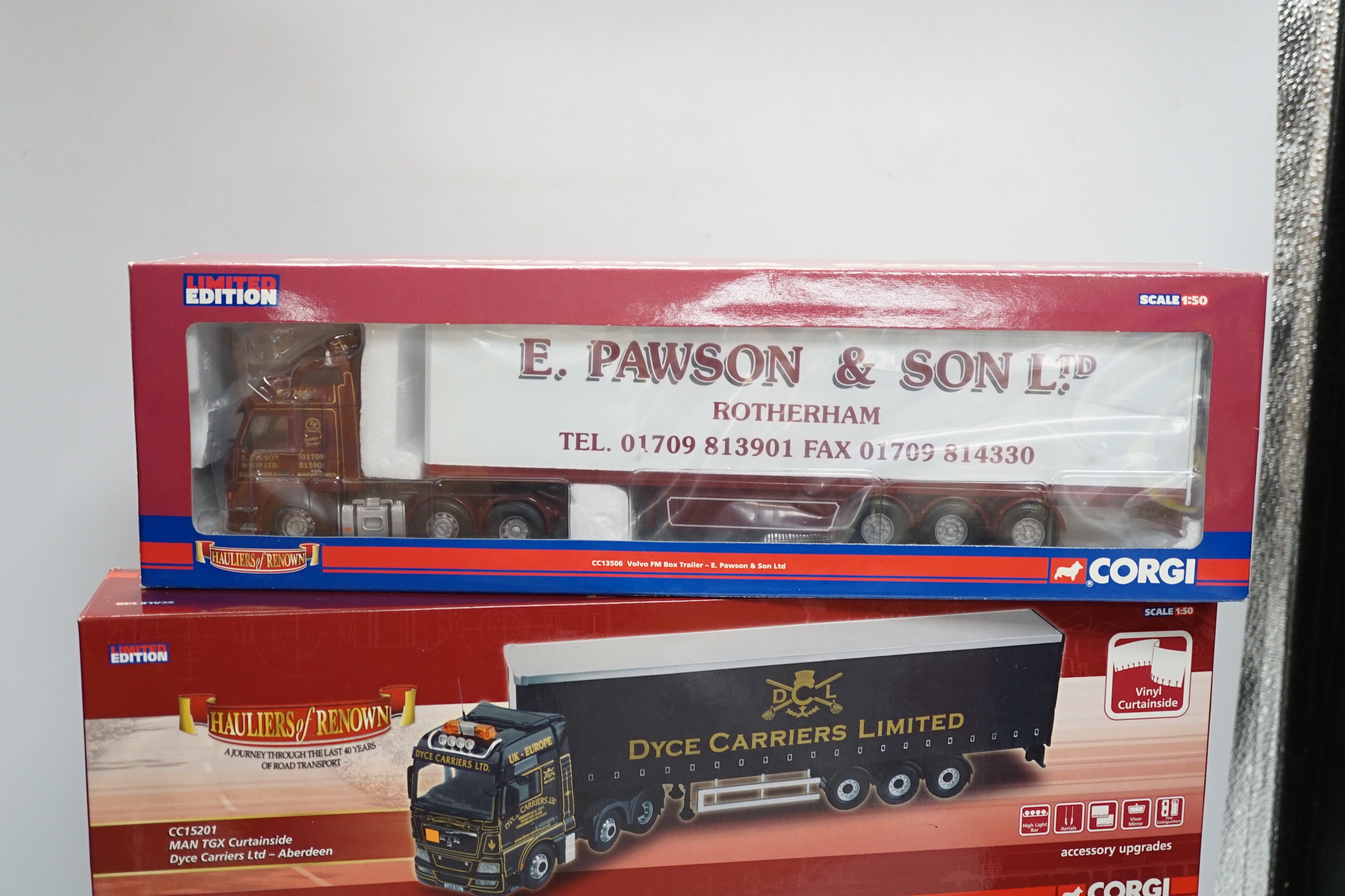 Four boxed Corgi 1:50 scale articulated trucks; a DAF CF curtainside (CC13601), a Volvo FM with box trailer (CC13506), a DAF XF Space Cab curtainside (CC13216), and a MAN TGX curtainside (CC15201)